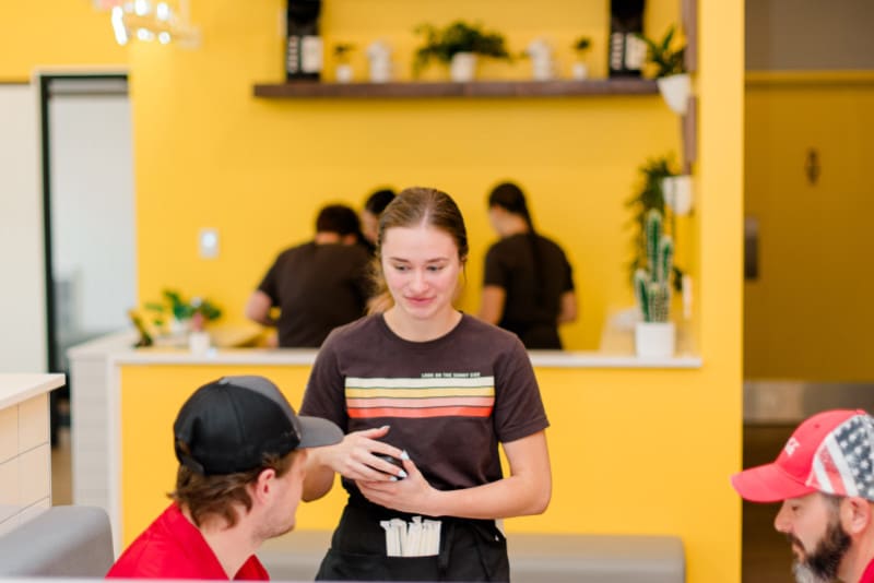 Over Easy Sioux Falls image of waitress taking customer orders